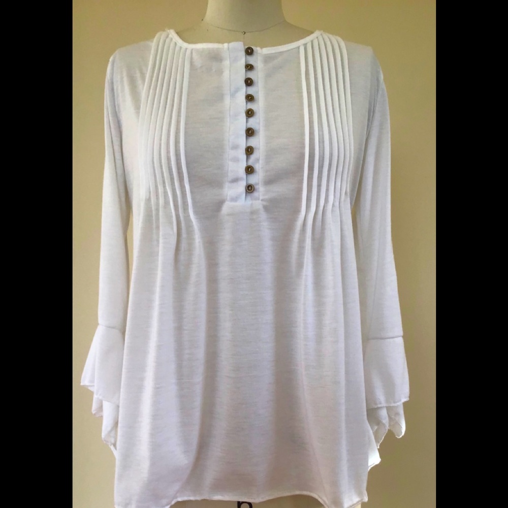 A pleated front off white top